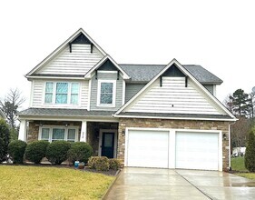 Building Photo - SPACIOUS FOUR BEDROOM