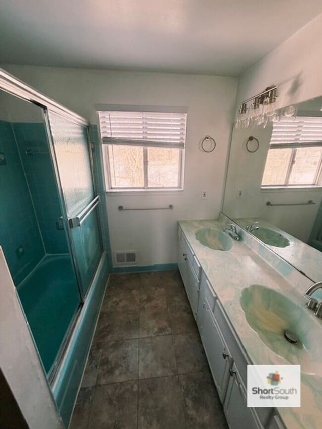 Building Photo - Updated - 2 bed 1.5 bath, Duplex with attached garage and fenced in backyard