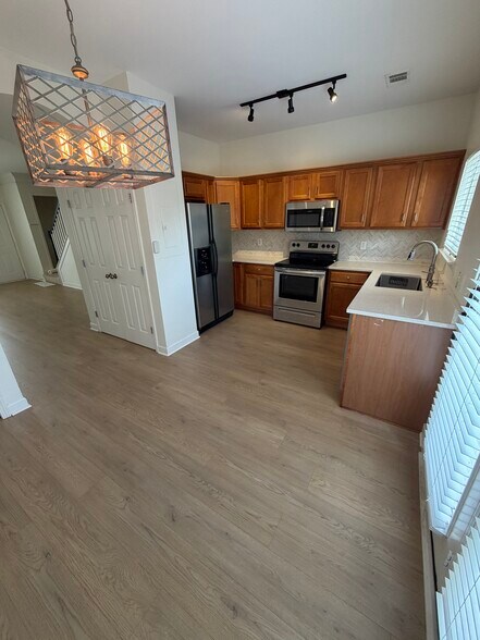 Kitchen view with all stainless steel appliances. - 2017A Beech Ave