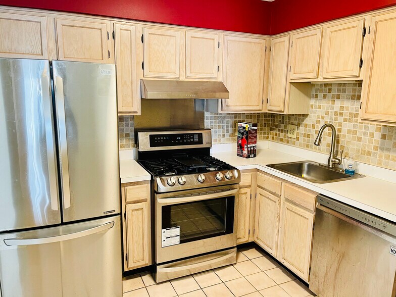 Modern updated kitchen with stainless steel appliances - 733 Waterford Dr