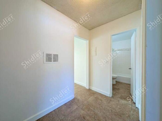 Building Photo - Upstairs 2 Bedroom 1 Bath with Massive Walk In Closet, Covered Gated Parking