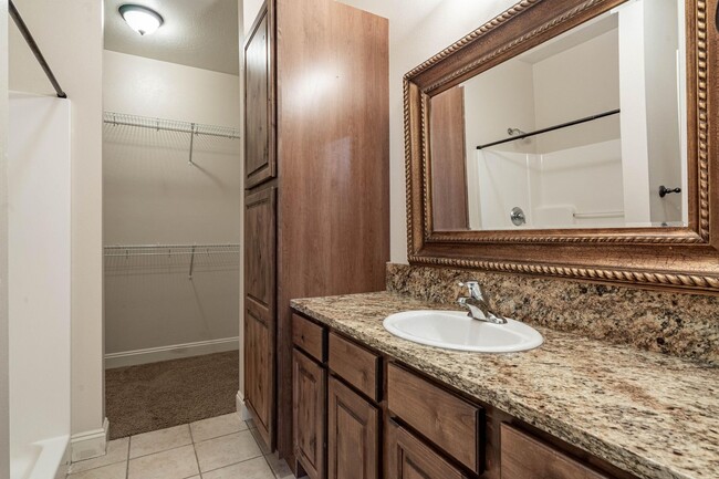 Bedroom 2 with attached full shower/toilet and walk in closet - 4100 Mullan Rd