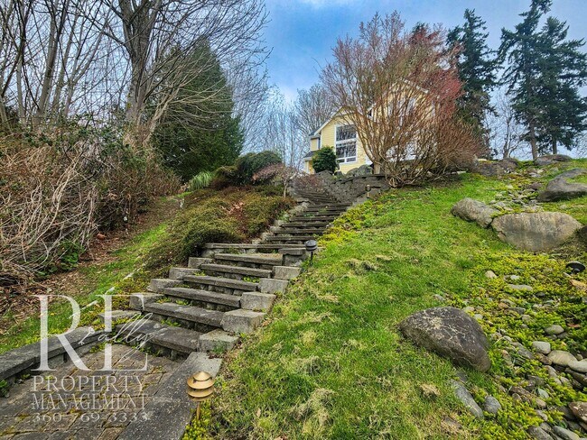 Building Photo - Light-Filled View Home with Vaulted Ceilings & Warm Wood Finishes