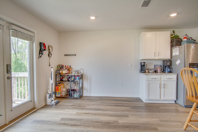 Building Photo - Spacious 4BR Home with 2-Car Garage Near M...