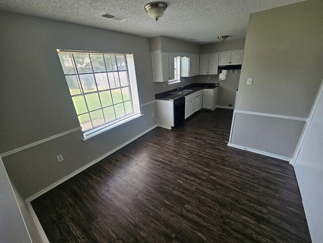 Building Photo - PREMIUM RENTAL! 3BR/2BA | Stone Fireplace & Hardwoods | Fenced Yard!
