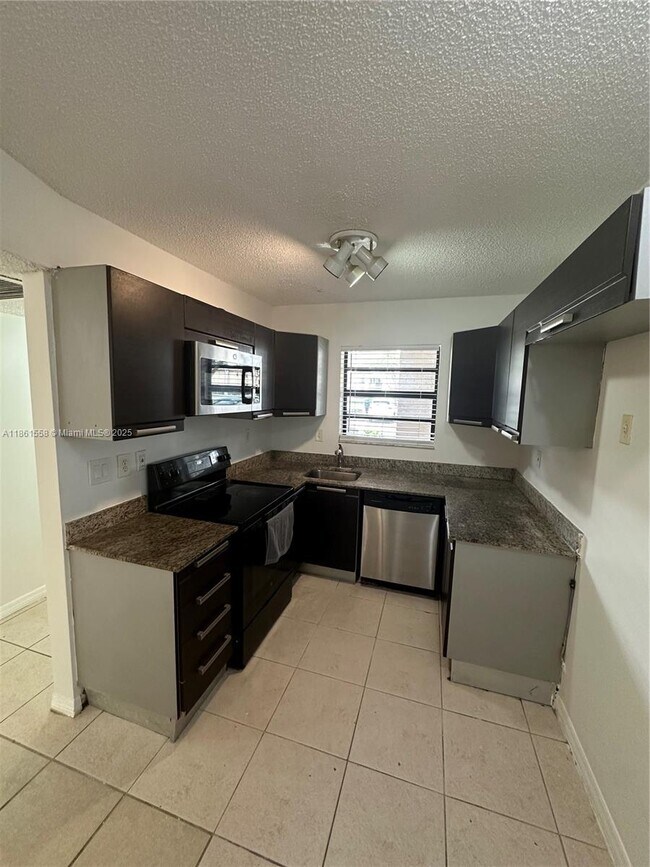 Building Photo - 11213 Royal Palm Blvd
