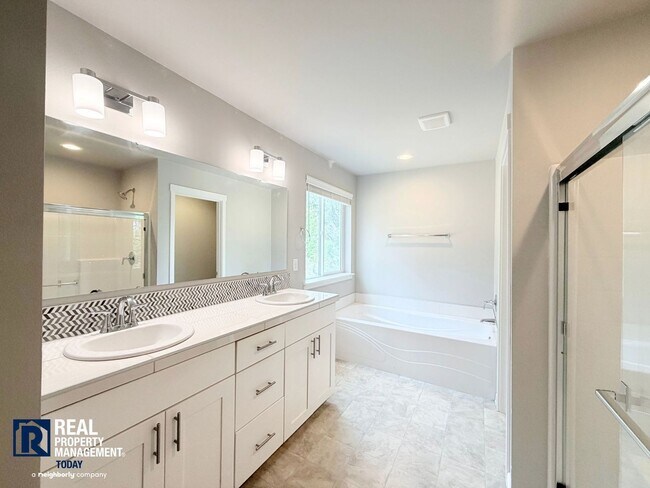 Building Photo - Easy JBLM Commute Like-New 4BR Home with 3-Car Garage & Bonus Office