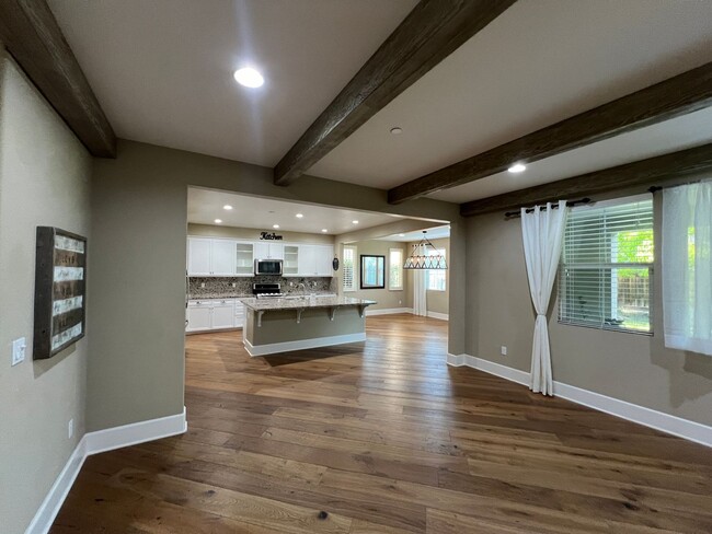 Building Photo - Former model home with tons of upgrades in...