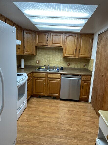 Kitchen with brand new dishwasher and microwave along with recently installed garbage disposal. - 240 W Kyle Dr