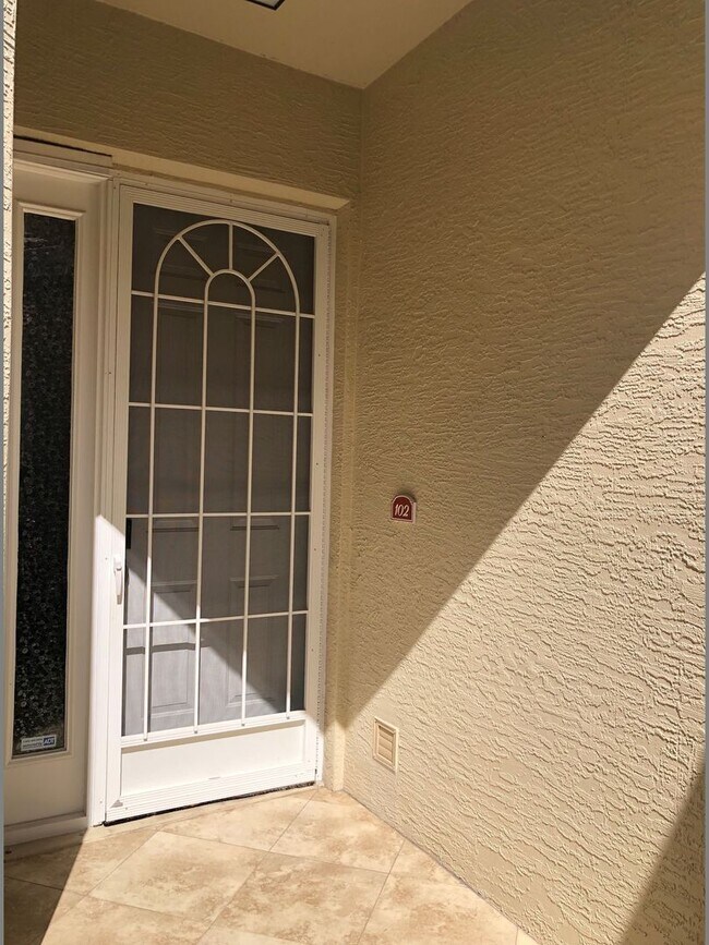 Building Photo - Experience Bell Tower Park. GATED ground floor 2 Bed 2 Bath Den 1 Car Garage Condo.