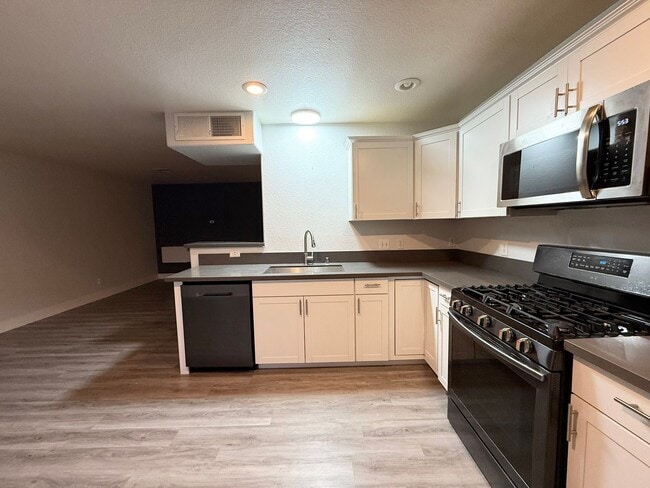 Building Photo - $500 OFF 1ST MONTHS RENT Updated 3-Bedroom Townhome in Gated Community with Pool Access