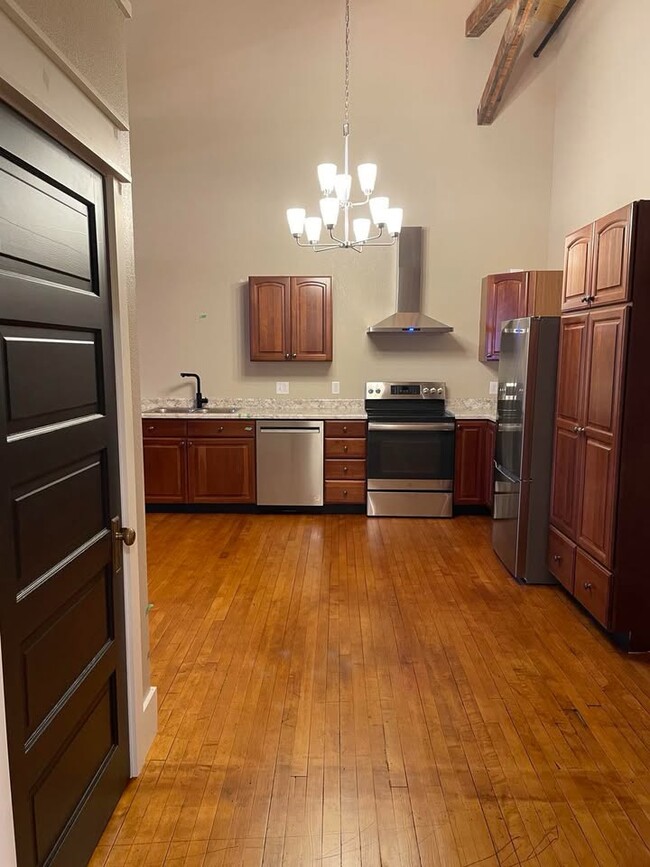 View from the kitchen coming out of the oversized bathroom. Door on the left is a coat closet - 211 E Water St