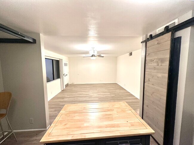 View from kitchen looking towards living room space. - 5303 Alhama Dr