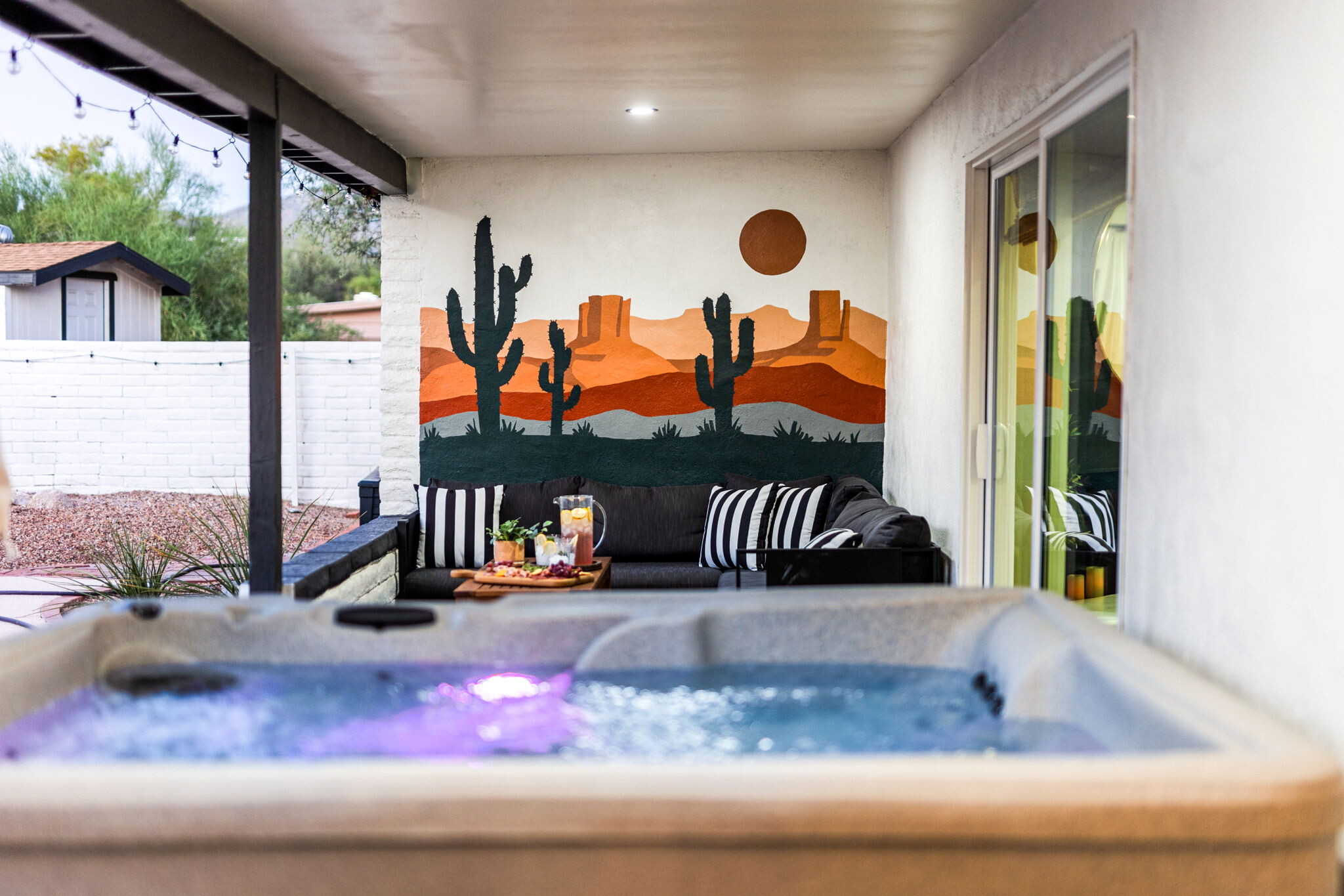 Covered Patio view of lounge area from the hot tub - 11205 E Chuckwagon Cir