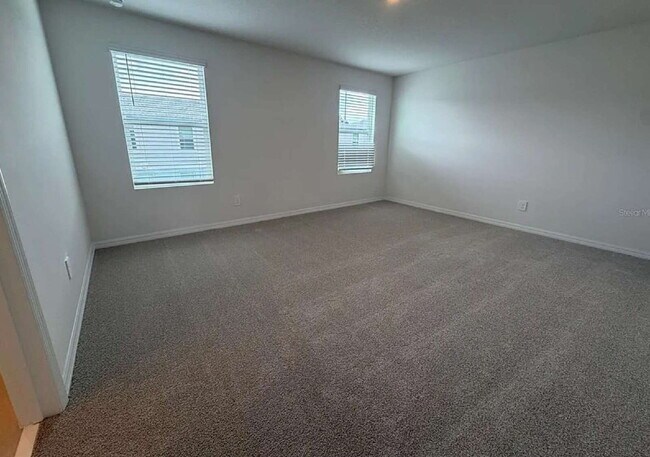 Building Photo - "Spacious 3-Bedroom Townhouse with Granite Elegance in St. Cloud – 4543 Rangeland Way"