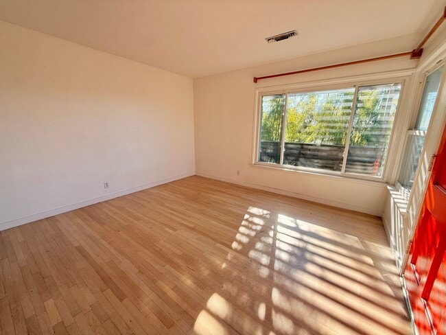 Building Photo - Hilltop Highland Park Sanctuary with Views, Private Gated Yard, In Unit Laundry, Parking & Abunda...