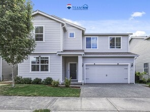 Building Photo - MOVE IN READY NOW! A/C! Multi generational living? Home office? Tumwater School District