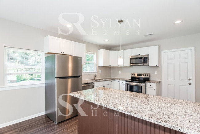 Building Photo - Turn the key. Enter. Smile. Repeat every day!