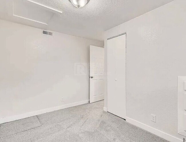 Building Photo - 7110 E 63rd Ave