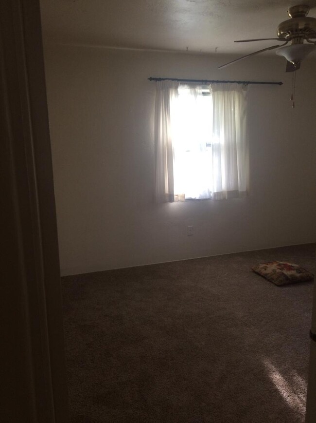9 overly dark pic of back bedroom (two windows here make foreground too dark for phone) - 1640 Columbia Dr SE