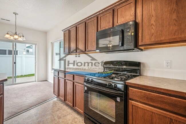 Building Photo - Townhouse Style Home with 3 Bedrooms, 2.5 Bathrooms, and a 2-Car Attached Garage Available in Coe...