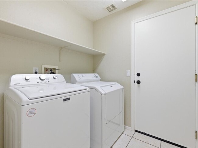 Building Photo - Spacious Living in a Gated Community with Amenities!