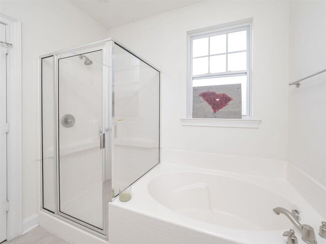 Building Photo - Spacious top-floor condo — 2BR/2BA with hardwood floors, electric fireplace & deposit-free move-i...