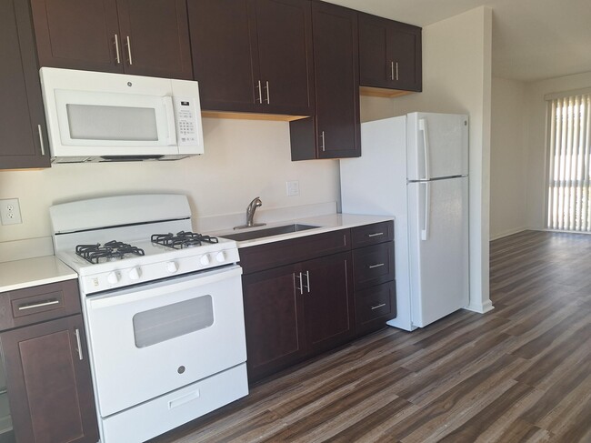 Kitchen leading into the living room - 3818 Merrimac Ave