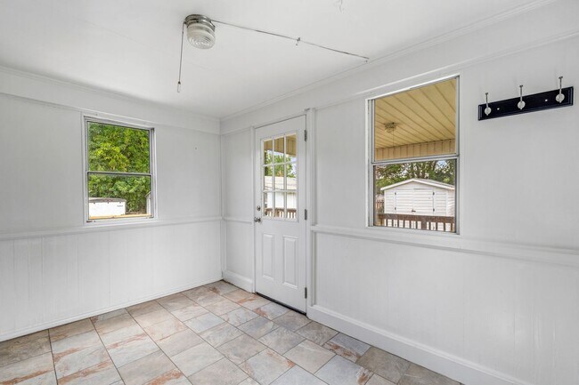 Building Photo - Large Renovated Ranch Home, Two Kitchens & Two Living Areas, Hardwood Flooring, Deck, Fenced!