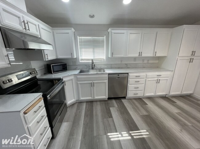 Building Photo - 3 Bed, 2 Bath Home with a Two-Car Garage, Fenced Backyard, and Lawn Care Included