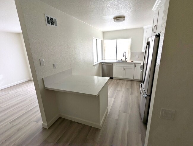 Building Photo - Total remodel - New kitchen, new bathroom, new appliances, new electrical, new paint, new floors