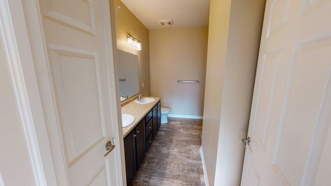 Building Photo - 3-Bedroom Ground-Level Unit with Rear View in Gated Community – Stair Access Required