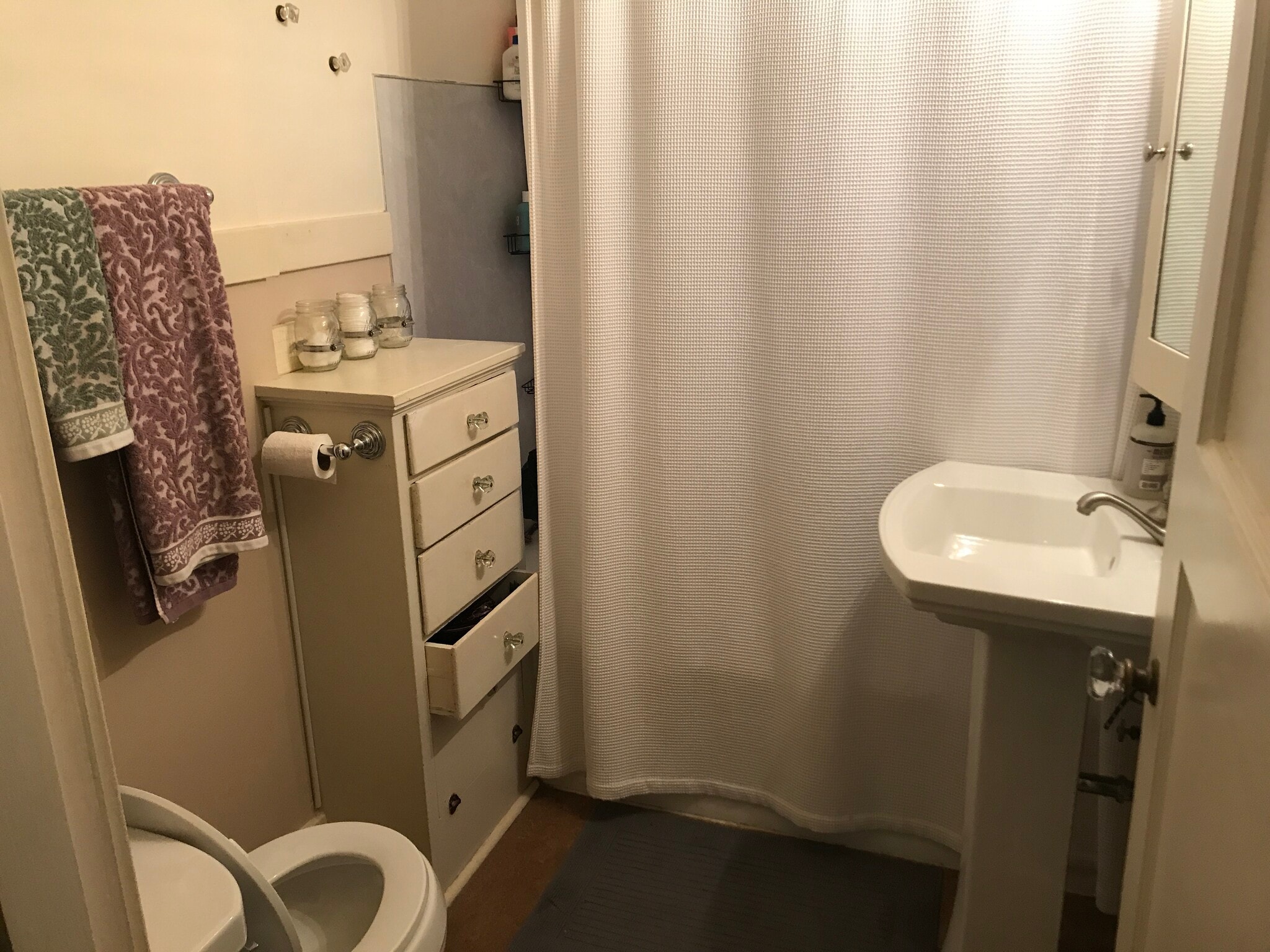 Bathroom with original cabinets. - 1827 NE 11th Ave