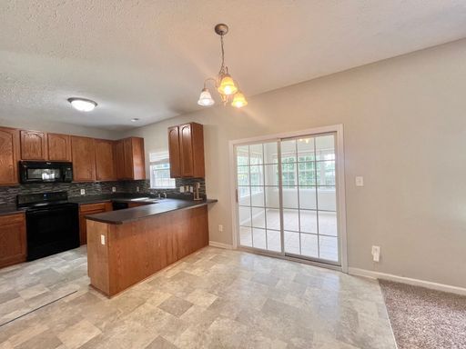 Building Photo - Charming 4BD, 2.5BA Durham Home with a Bonus Sun-Room & Fenced In Yard Only 10 Minutes Away from ...