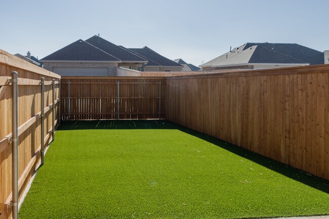 Private, fenced in back yard w/gorgeous turf - 3723 116th St