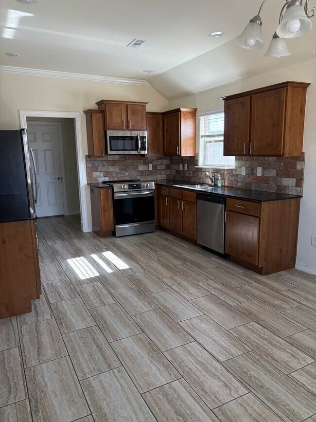 Building Photo - NEWER HOME - ALL APPLIANCES INCLUDED - LARGE FENCED IN BACKYARD