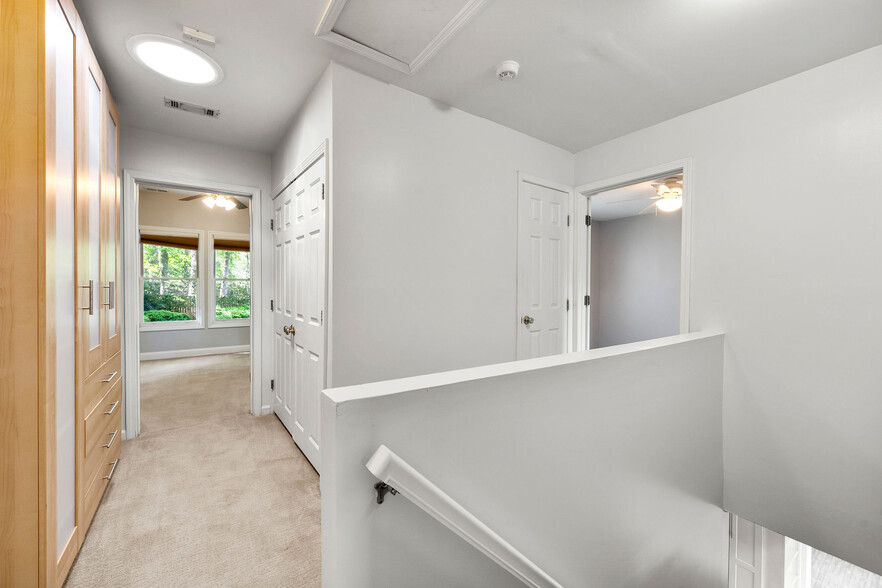 Upstairs hallway with laundry in center - 121 Brower Street