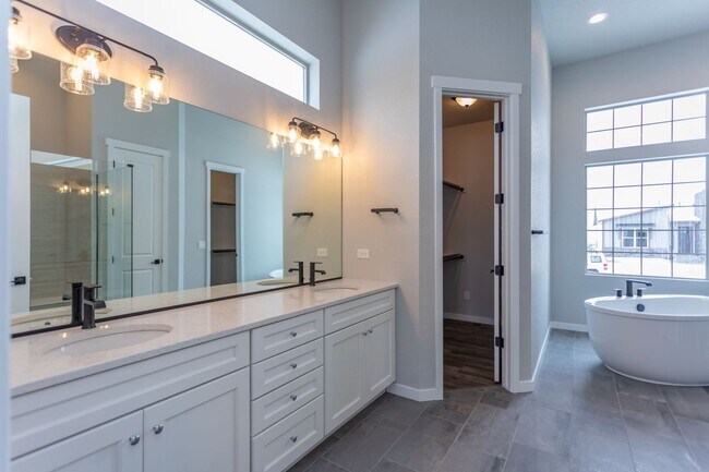 Building Photo - Exceptional 4-Bedroom Home with Dual Fireplaces, Main Level Master Suite, and Spacious Basement -...