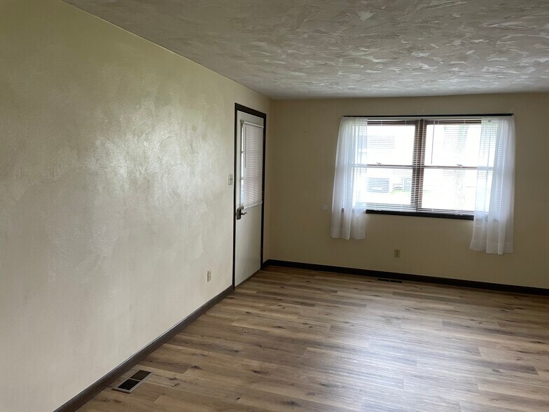115 S clinton living room Grass Roots Properties LLC - 115 S Clinton St