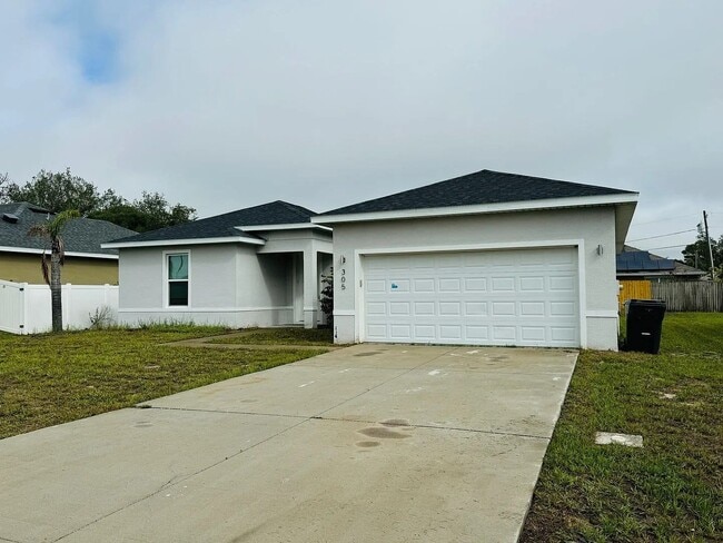 Building Photo - Beautiful New 3-Bedroom Home with Spacious Layout & 2-Car Garage in Poinciana Villages