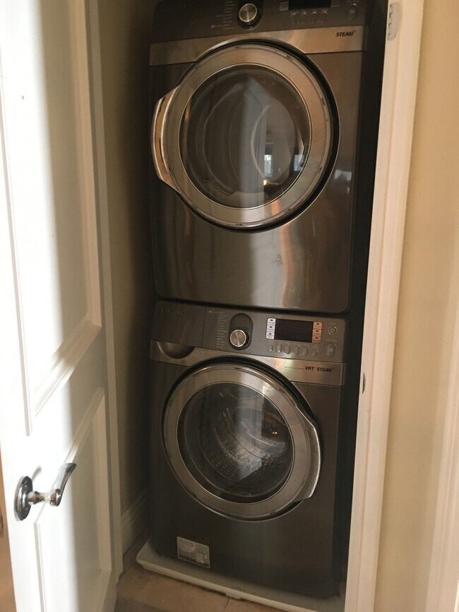 Stacked Samsung washer dryer with steam function - 1540 S Bentley Ave