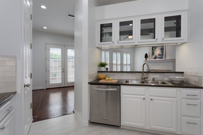 Building Photo - Gorgeous Mediterranean-style condo located...