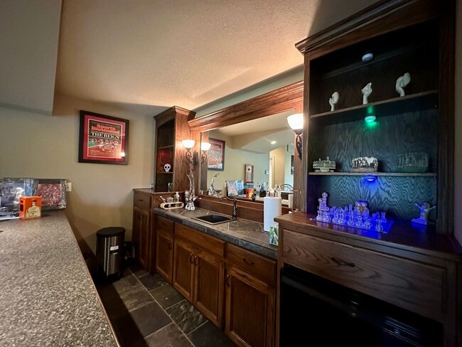 Building Photo - {9003} Wilshire Farms Reverse 1.5 Story Ho...