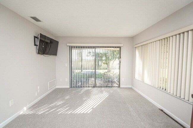 Building Photo - Welcome to this spacious three-bedroom, three-bath home in the heart of Palm Bay