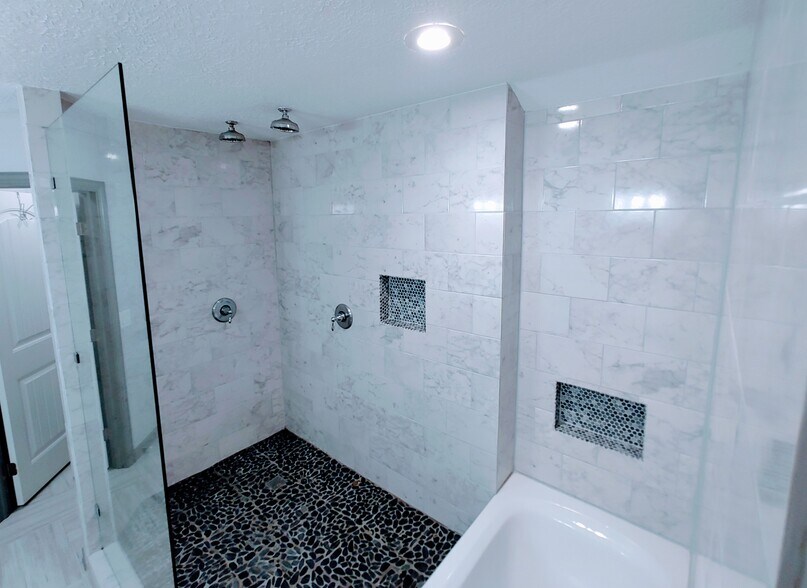 Double shower with natural stone floor - 2 Arnica Ct