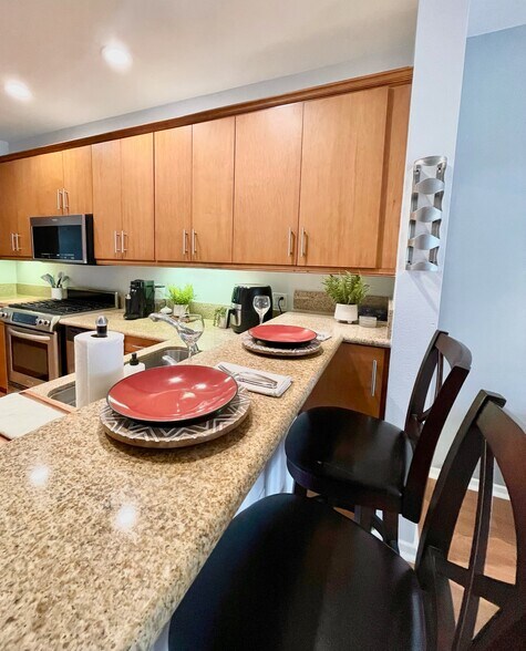 Eat-in kitchen with bar seating for casual dining or entertaining. - 3687 4th Ave