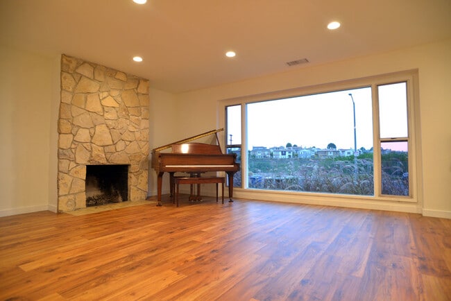 Living Room Stone Fireplace - 7930 Campion Dr