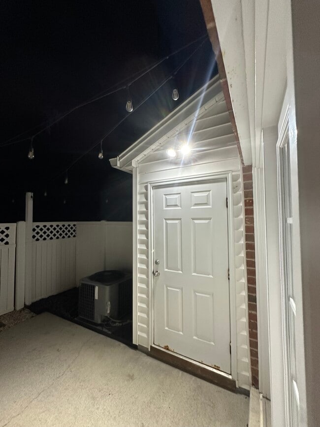 Spotlight in back patio for safety - 1215 Green Oaks Ln