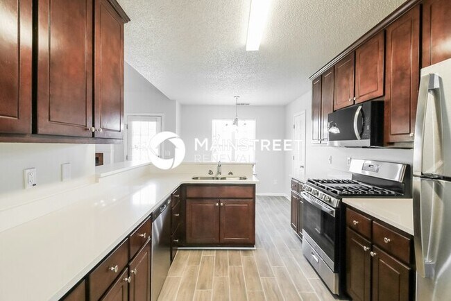 Building Photo - 4 Bedroom Pet-Friendly Home in REX, GA with Main Street Renewal