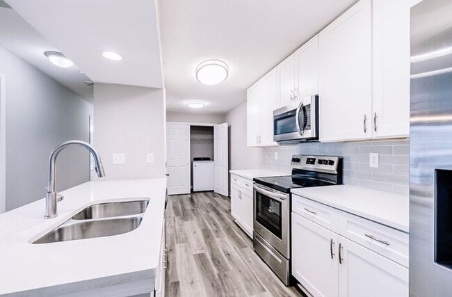 Building Photo - Spacious 2-Bedroom Elite Apartment with Private Balconies & Washer/Dryer